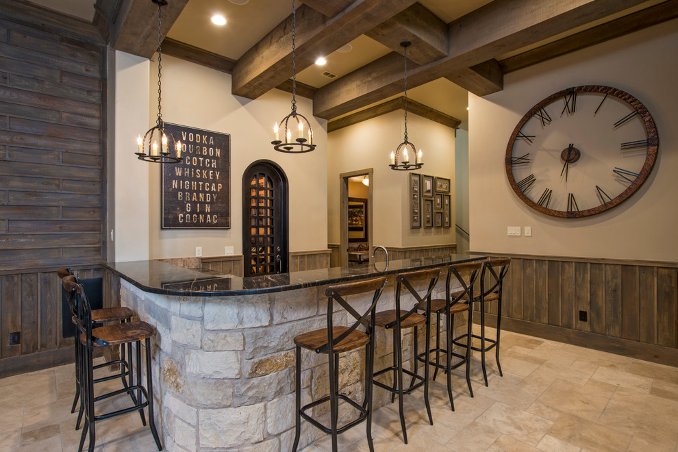 Country l-shaped seated home bar in Austin with travertine floors and beige floor.