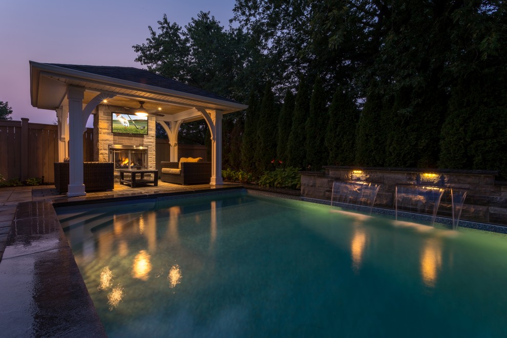 Pool - transitional backyard pool idea in Toronto