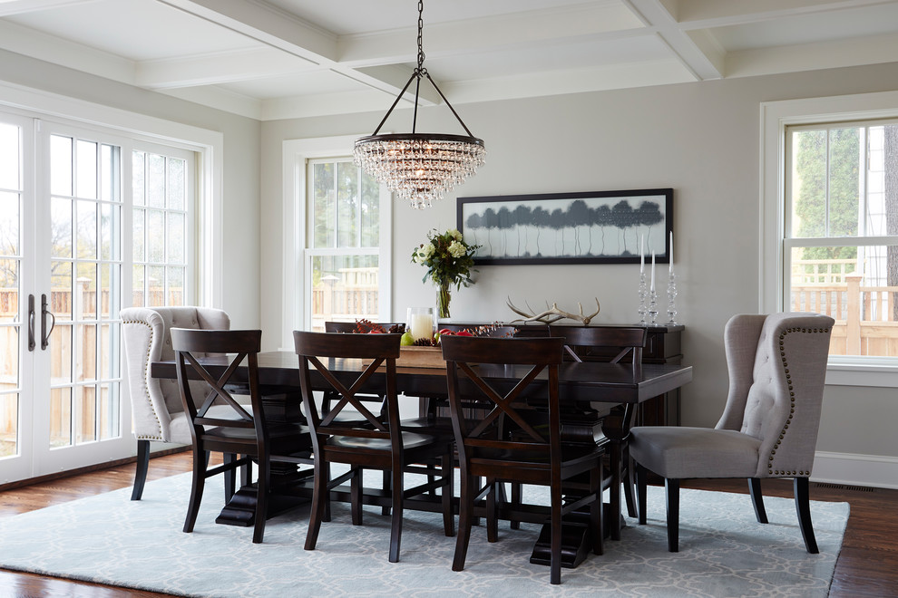 Design ideas for a traditional dining room in Minneapolis with grey walls and dark hardwood floors.