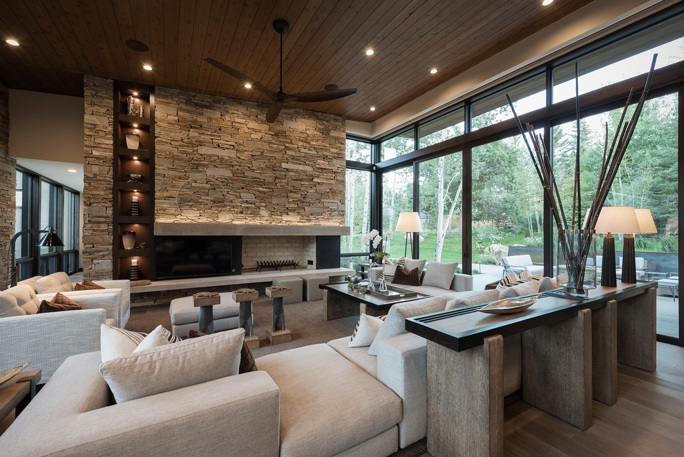 Contemporary living room in Salt Lake City with beige walls, light hardwood floors, a standard fireplace and no tv.