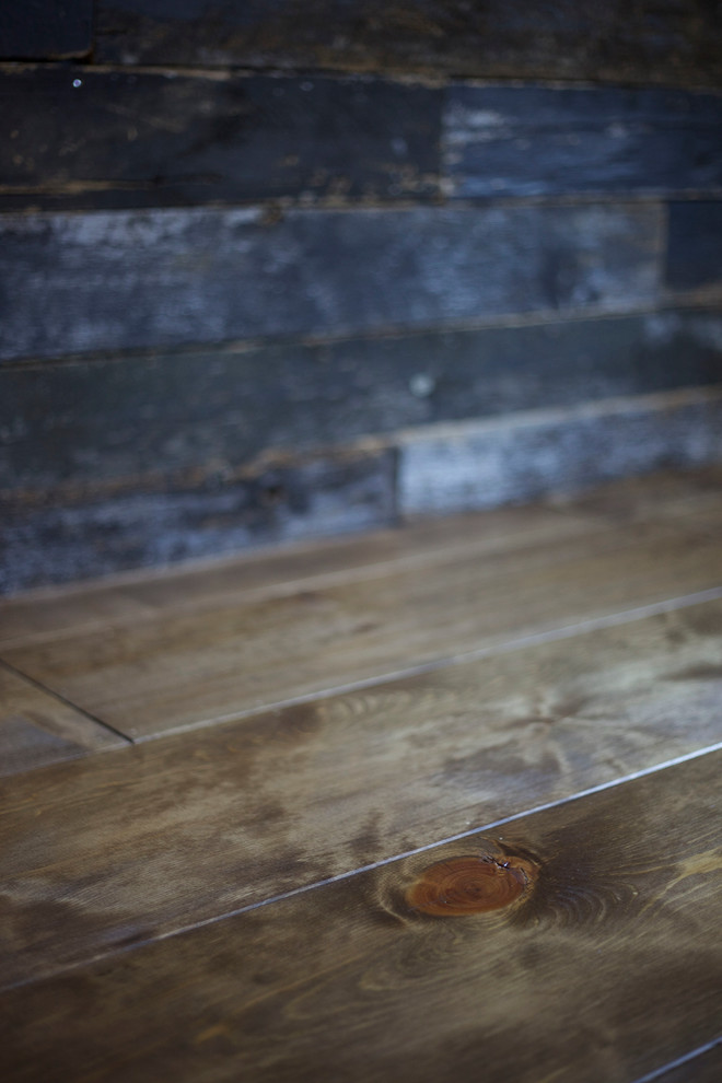 Inspiration for a mid-sized rustic master medium tone wood floor home design remodel in Phoenix with gray walls