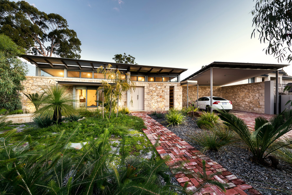 Inspiration for a contemporary one-storey exterior in Perth with stone veneer and a flat roof.