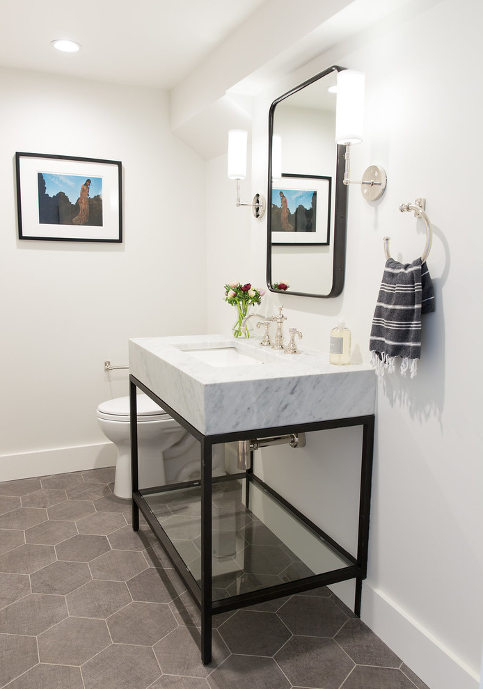 Transitional powder room in San Francisco with open cabinets, black cabinets, white walls, porcelain floors, an undermount sink, marble benchtops and grey floor.