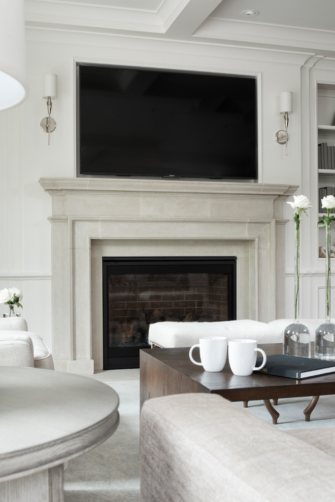This is an example of a mid-sized transitional formal open concept living room in Minneapolis with grey walls, light hardwood floors, a standard fireplace, a stone fireplace surround and a wall-mounted tv.