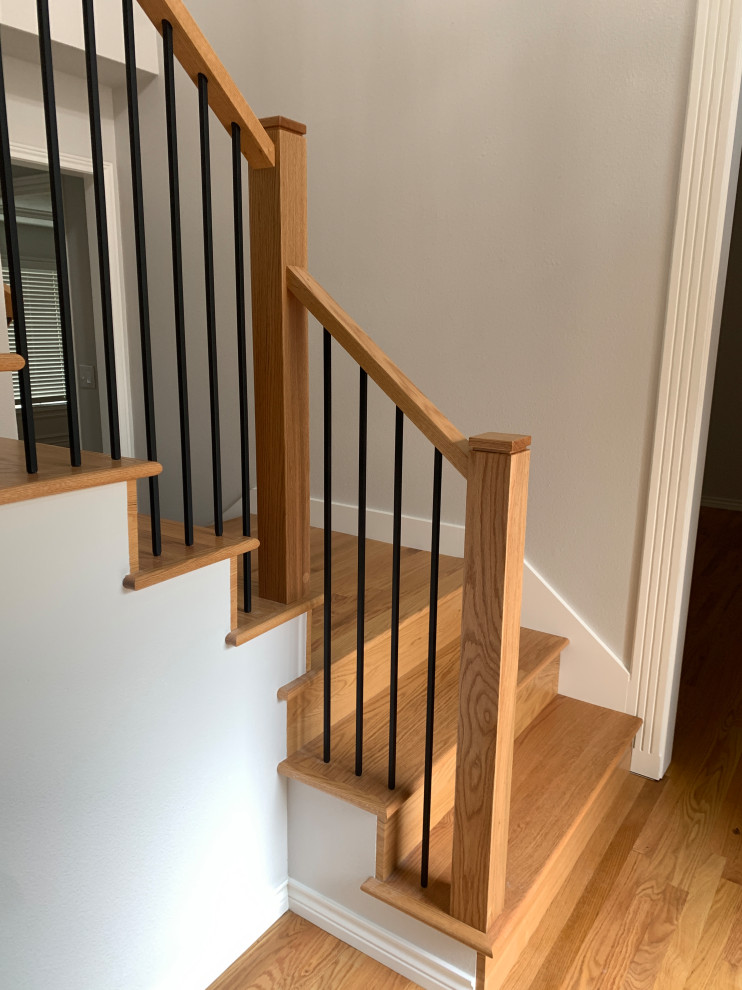 This is an example of a medium sized modern straight mixed railing staircase in Portland.