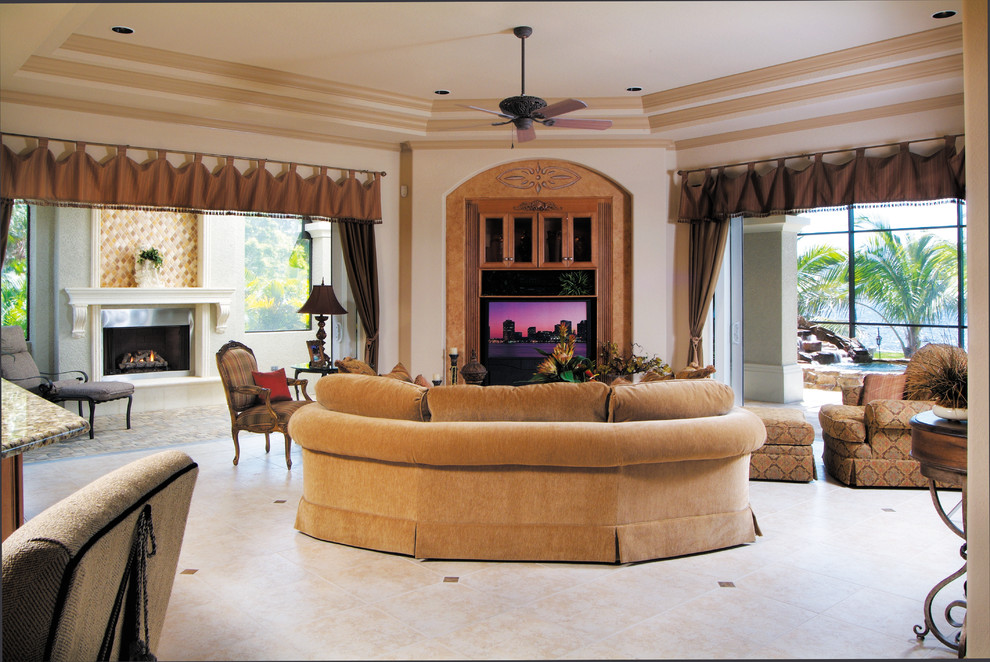 Photo of a large mediterranean open concept family room in Miami with beige walls, ceramic floors, no fireplace and a built-in media wall.