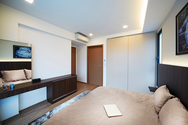 This is an example of a mid-sized modern master bedroom in Singapore with white walls and dark hardwood floors.