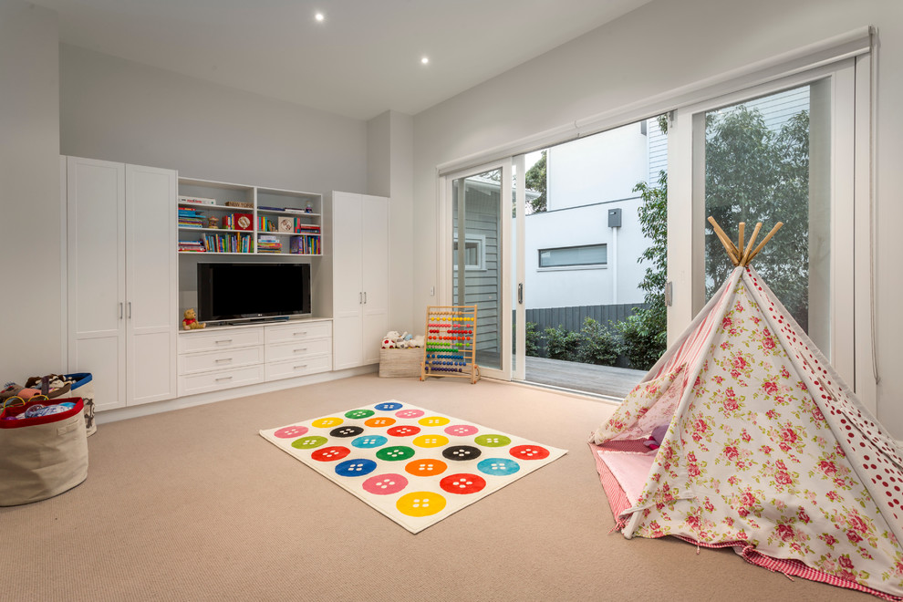 Inspiration for a large traditional kids' playroom for kids 4-10 years old and girls in Melbourne with white walls and carpet.