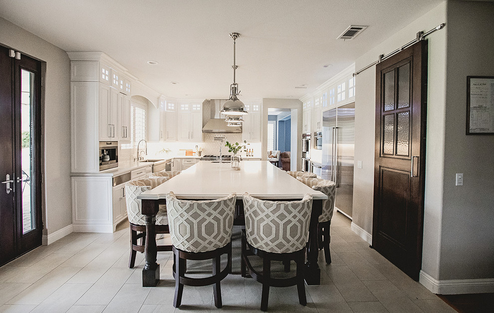 Example of a large transitional home design design