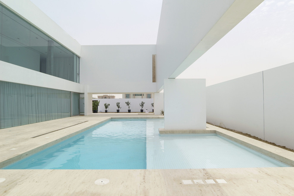 Inspiration for a large modern backyard custom-shaped pool in Other.