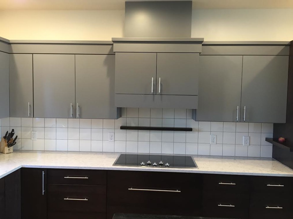 Example of a mid-sized transitional l-shaped medium tone wood floor eat-in kitchen design in Cedar Rapids with a double-bowl sink, flat-panel cabinets, gray cabinets, quartz countertops, white backsplash, ceramic backsplash, stainless steel appliances and an island