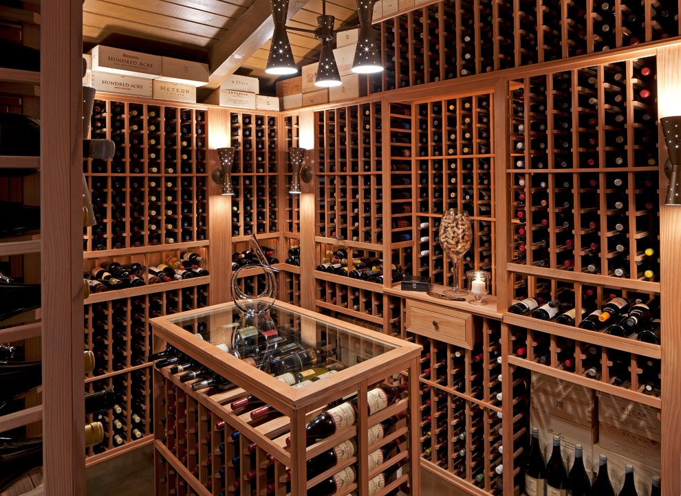 Large midcentury wine cellar in Los Angeles with storage racks.
