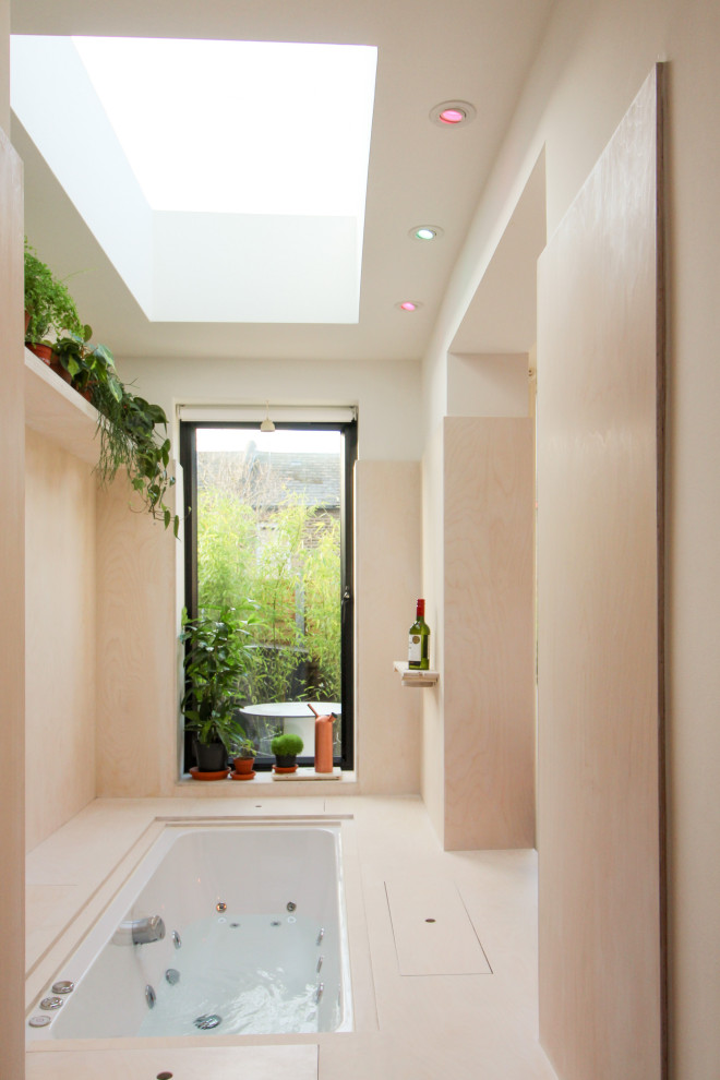 Photo of a small contemporary indoor rectangular aboveground pool in London.