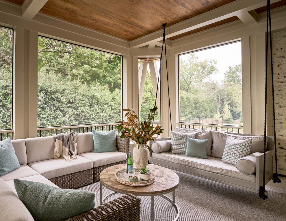 Large transitional porch idea in Charlotte