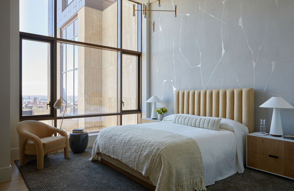 Trendy guest wallpaper bedroom photo in New York with gray walls