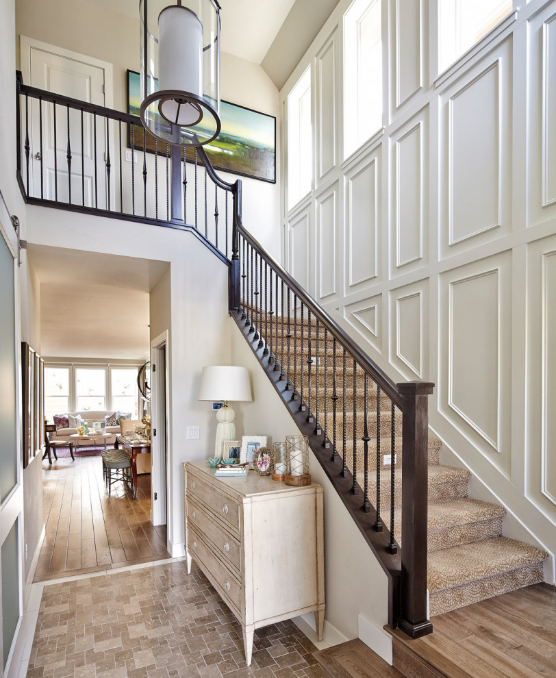 Example of a transitional mixed material railing staircase design in Denver
