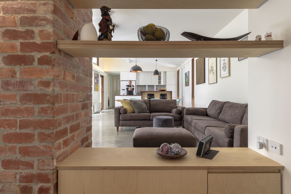This is an example of a small contemporary vestibule in Canberra - Queanbeyan with white walls, concrete floors, a single front door, a glass front door and grey floor.