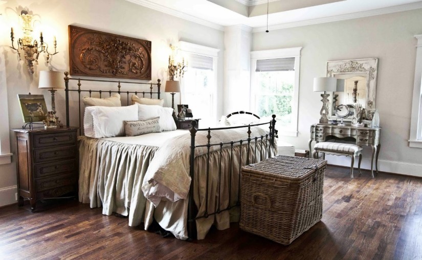 This is an example of a large country guest bedroom in Other with white walls and carpet.