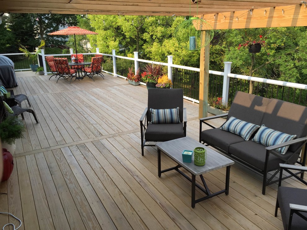 Deck - backyard deck idea in Cedar Rapids with a pergola