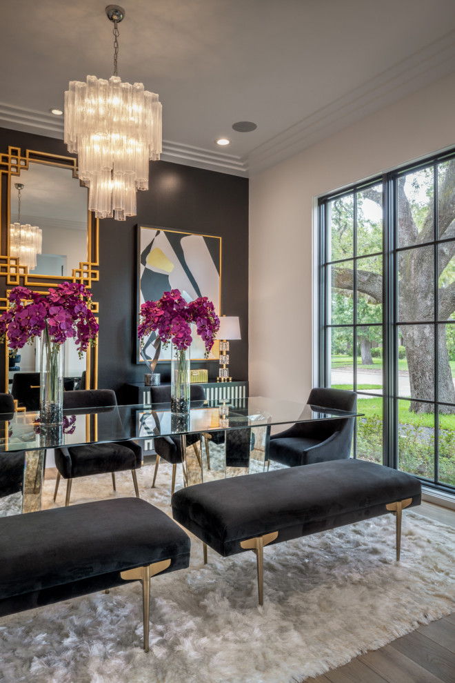 Photo of a contemporary dining room in Houston with black walls, dark hardwood floors and brown floor.