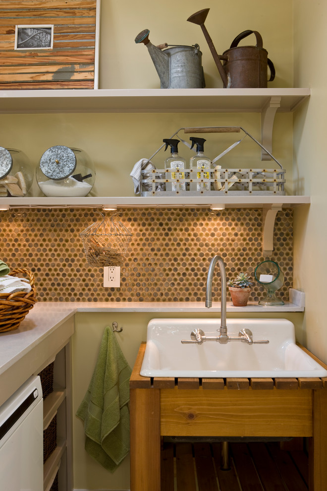 Inspiration for a country laundry room in DC Metro with a drop-in sink, open cabinets, quartz benchtops, a side-by-side washer and dryer and beige walls.