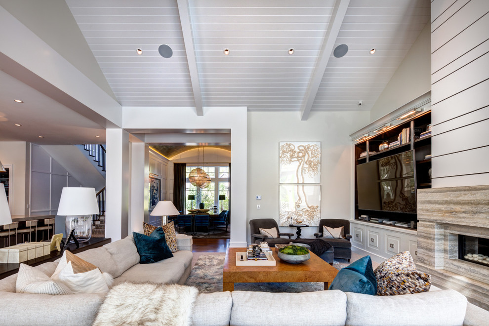 Inspiration for a large transitional formal open concept living room in Orange County with white walls, carpet, a ribbon fireplace, a built-in media wall, a stone fireplace surround and brown floor.