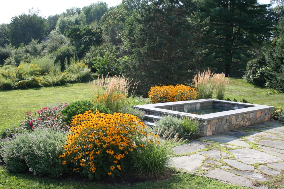Inspiration for a traditional backyard rectangular natural pool in Boston.