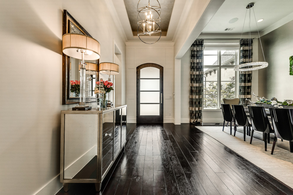 Front door - mid-sized transitional dark wood floor front door idea in Dallas with beige walls and a metal front door