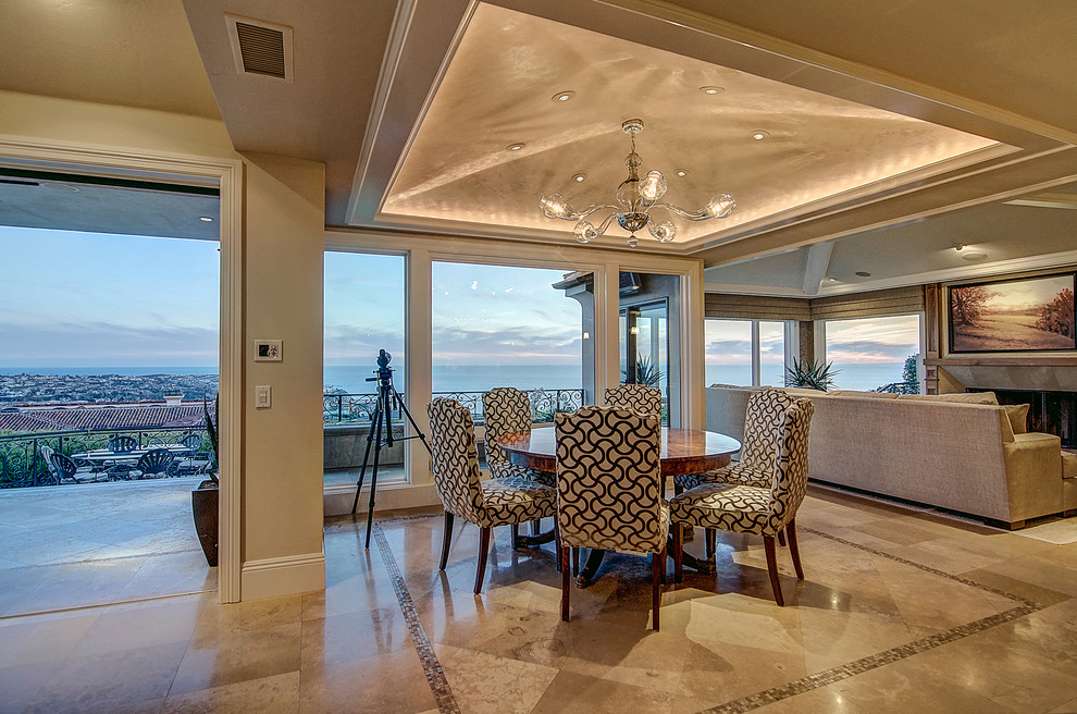 Inspiration for a transitional travertine floor and beige floor great room remodel in Orange County with beige walls