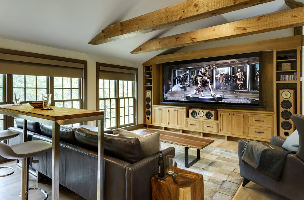 Country enclosed home theatre in New York with light hardwood floors and a projector screen.