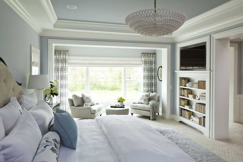 Design ideas for an expansive traditional master bedroom in Minneapolis with carpet, no fireplace and blue walls.