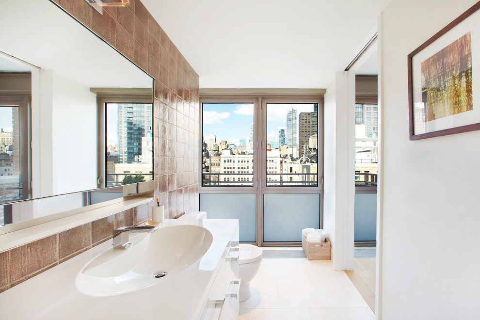 This is an example of a contemporary bathroom in New York with an integrated sink.