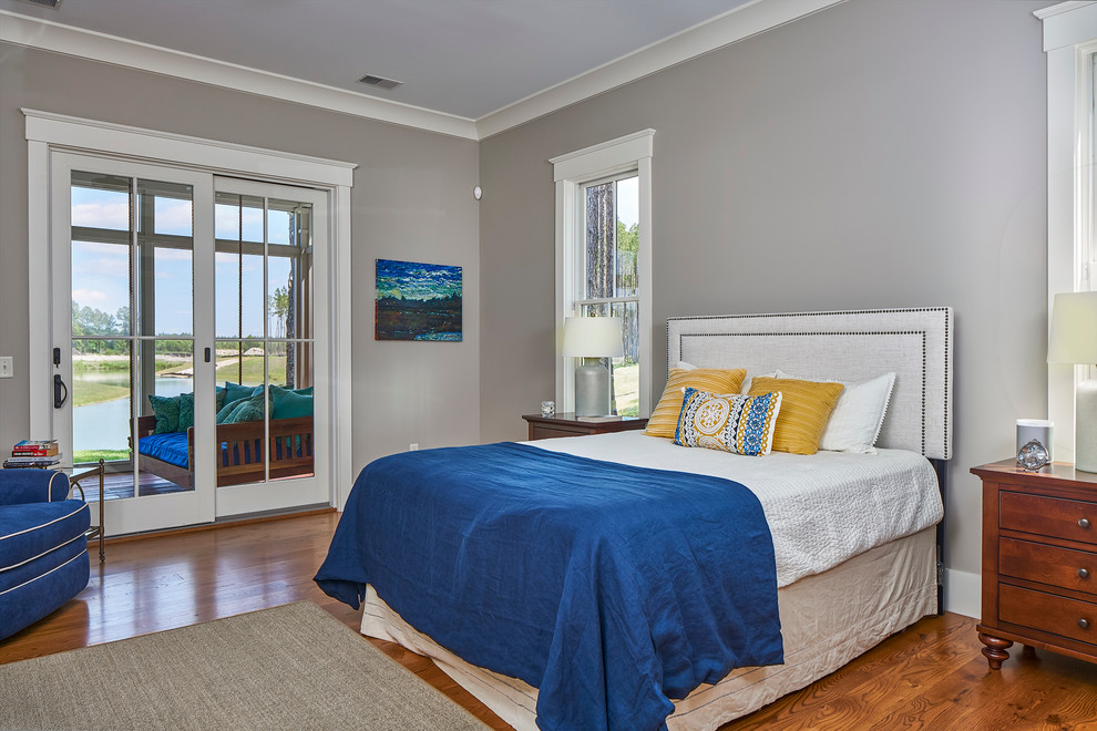 This is an example of a mid-sized transitional master bedroom in Charleston with grey walls and medium hardwood floors.