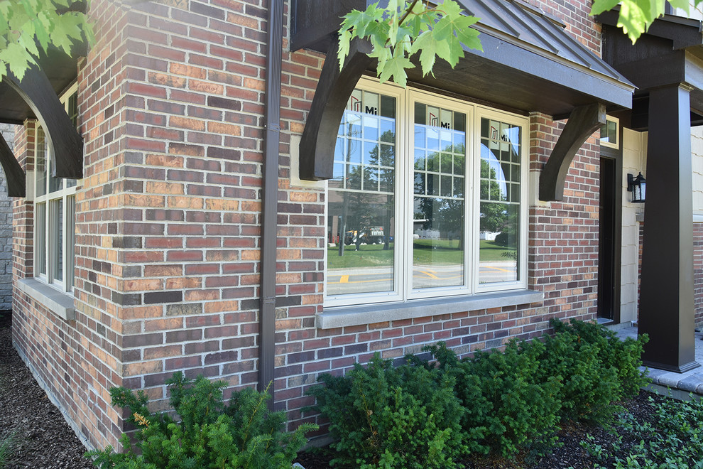 Almond Casements on Brick Traditional Chicago by MI Windows and Doors
