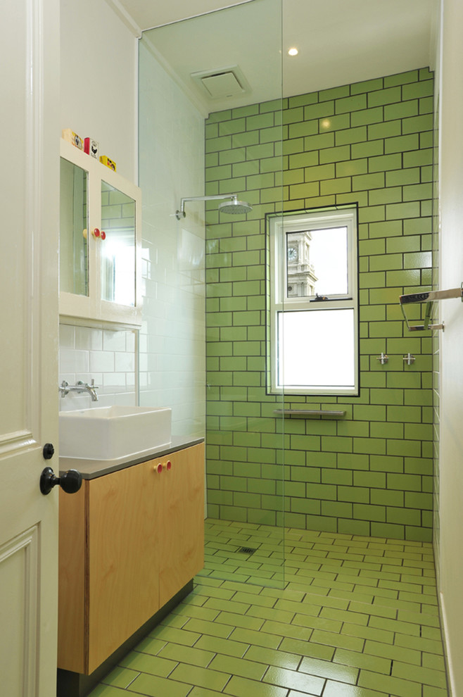 Small transitional master bathroom in Melbourne with flat-panel cabinets, light wood cabinets, an open shower, a one-piece toilet, green tile, ceramic tile, white walls, ceramic floors, a vessel sink and engineered quartz benchtops.