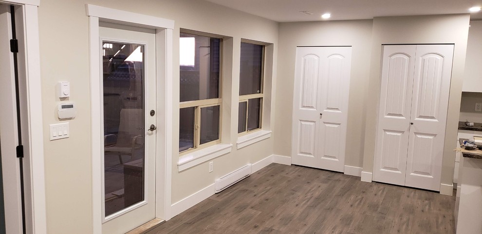Example of a transitional home design design in Vancouver