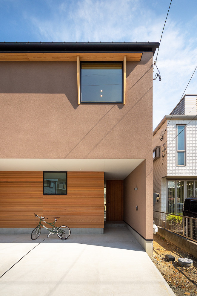 Idee per la facciata di una casa scandinava a due piani con copertura in metallo o lamiera