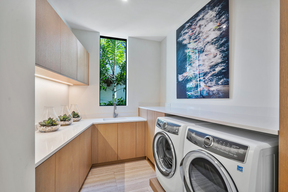 Design ideas for a large contemporary dedicated laundry room in Miami.