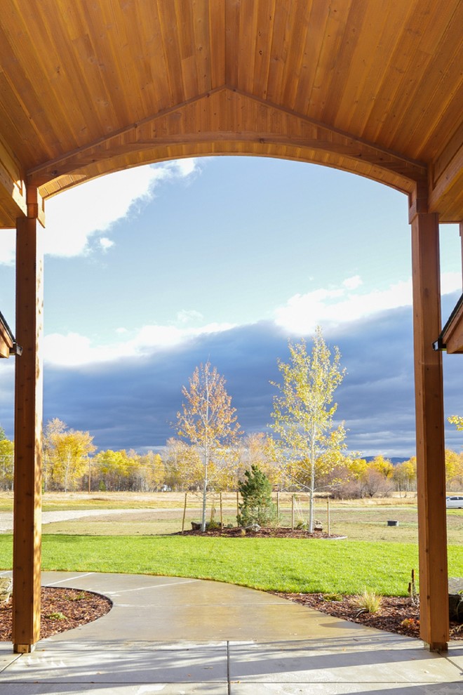 Inspiration for a large rustic front door remodel with a dark wood front door