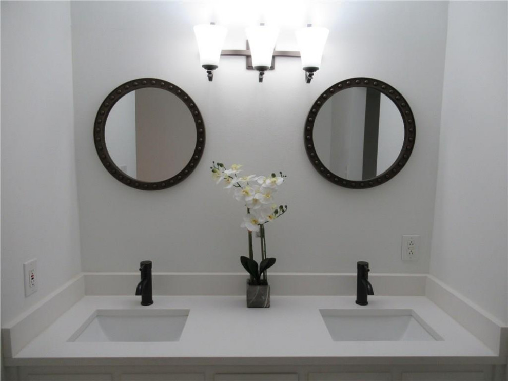 Mid-sized transitional master ceramic tile ceramic tile, white floor and double-sink bathroom photo in Dallas with recessed-panel cabinets, white cabinets, a two-piece toilet, white walls, an undermount sink, quartz countertops, white countertops and a built-in vanity
