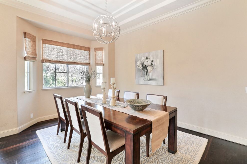 This is an example of a mid-sized transitional dining room in San Francisco with beige walls and dark hardwood floors.