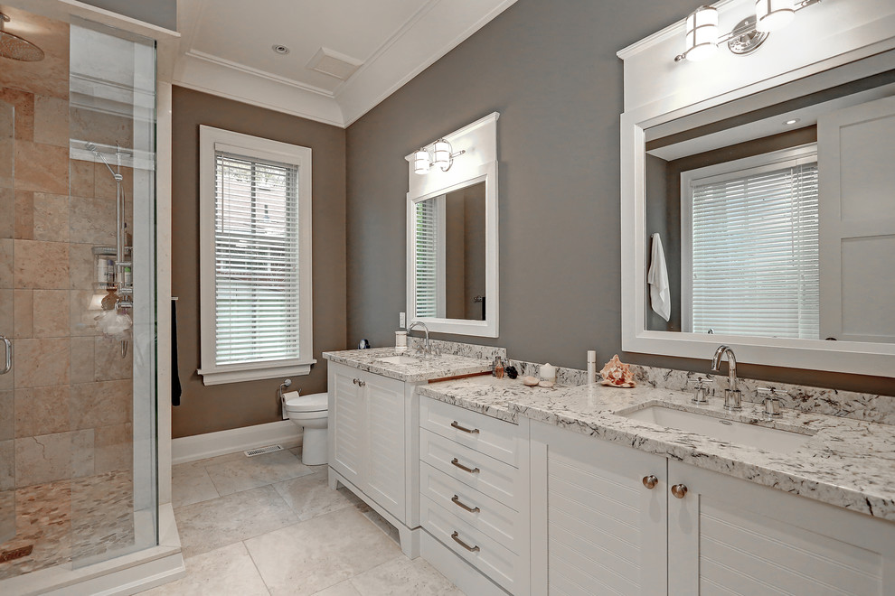 Inspiration for a traditional bathroom in Toronto with shaker cabinets, white cabinets, a corner shower, beige tile, grey walls and an undermount sink.