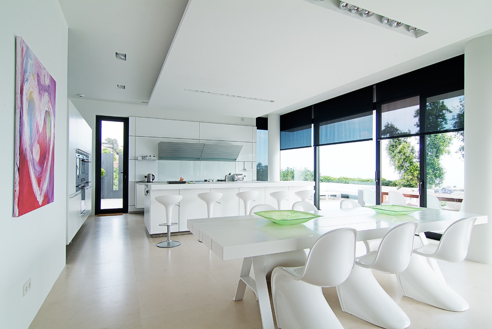 Photo of a large contemporary kitchen/dining combo in London with white walls, ceramic floors and no fireplace.