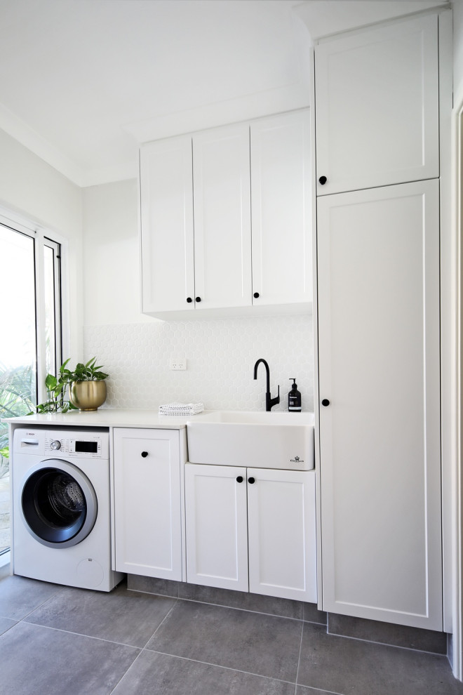 Design ideas for a transitional laundry room in Perth.