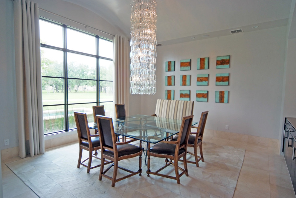 Modern dining room in Dallas with white walls.