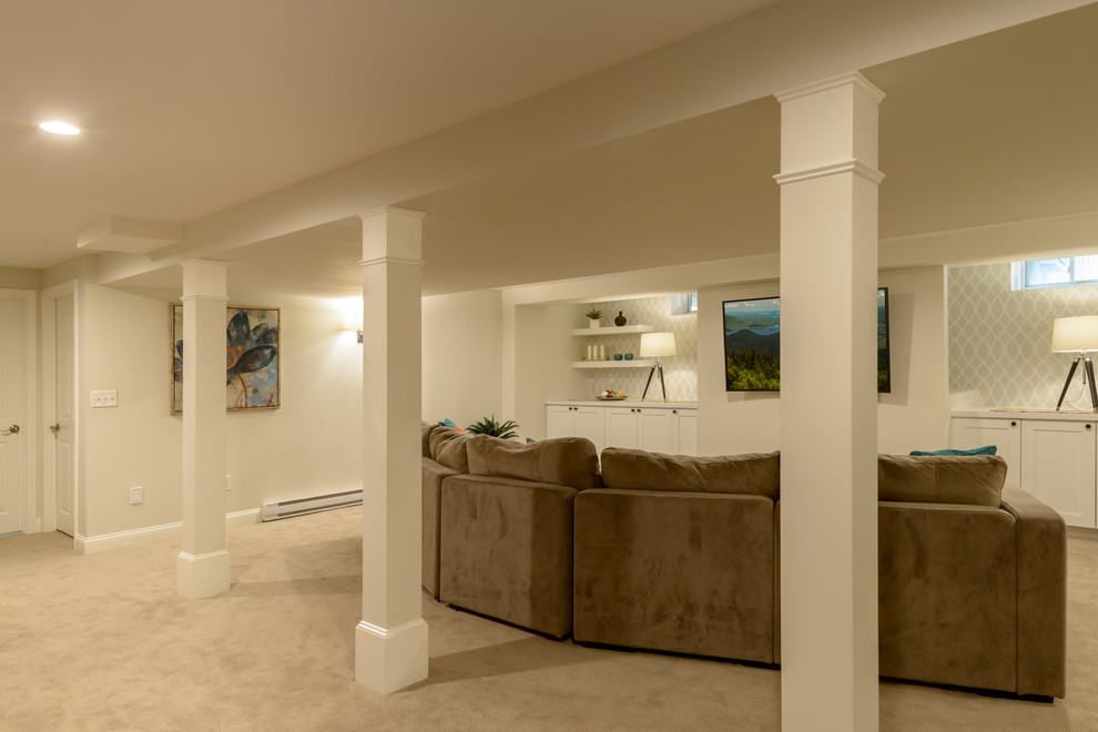 Transitional look-out basement in Boston with white walls, carpet and beige floor.