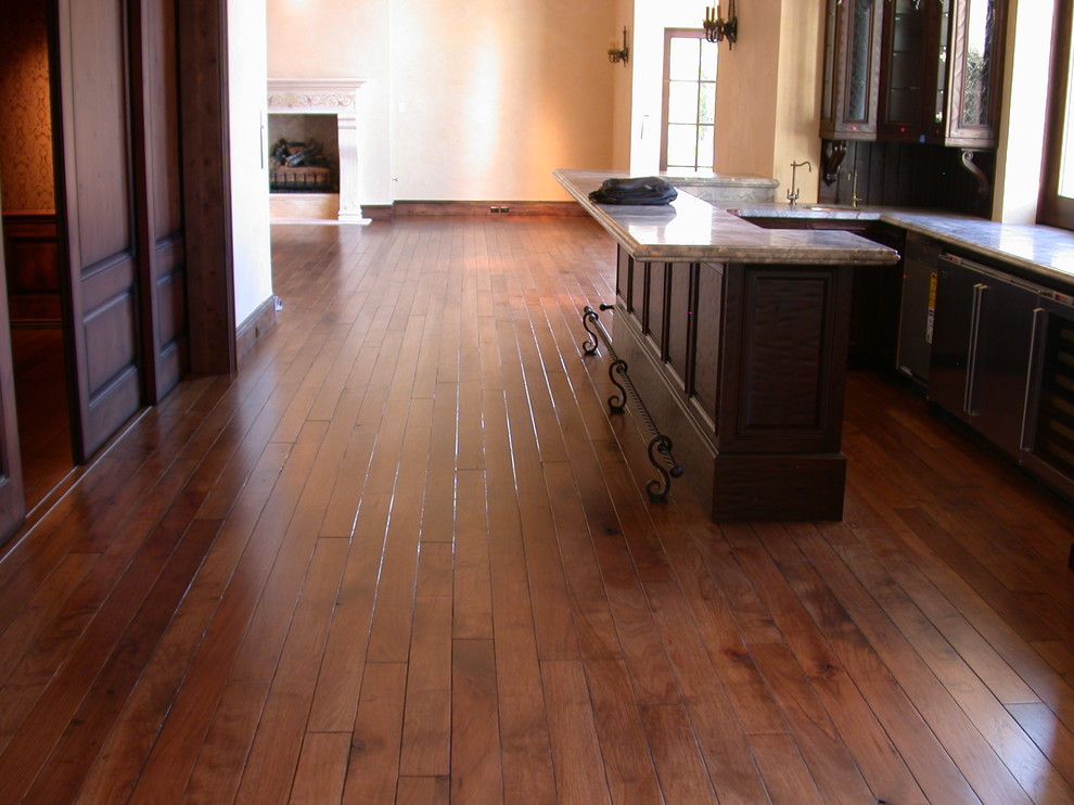 Kitchen - small transitional u-shaped medium tone wood floor and brown floor kitchen idea in Phoenix with recessed-panel cabinets, dark wood cabinets and a peninsula