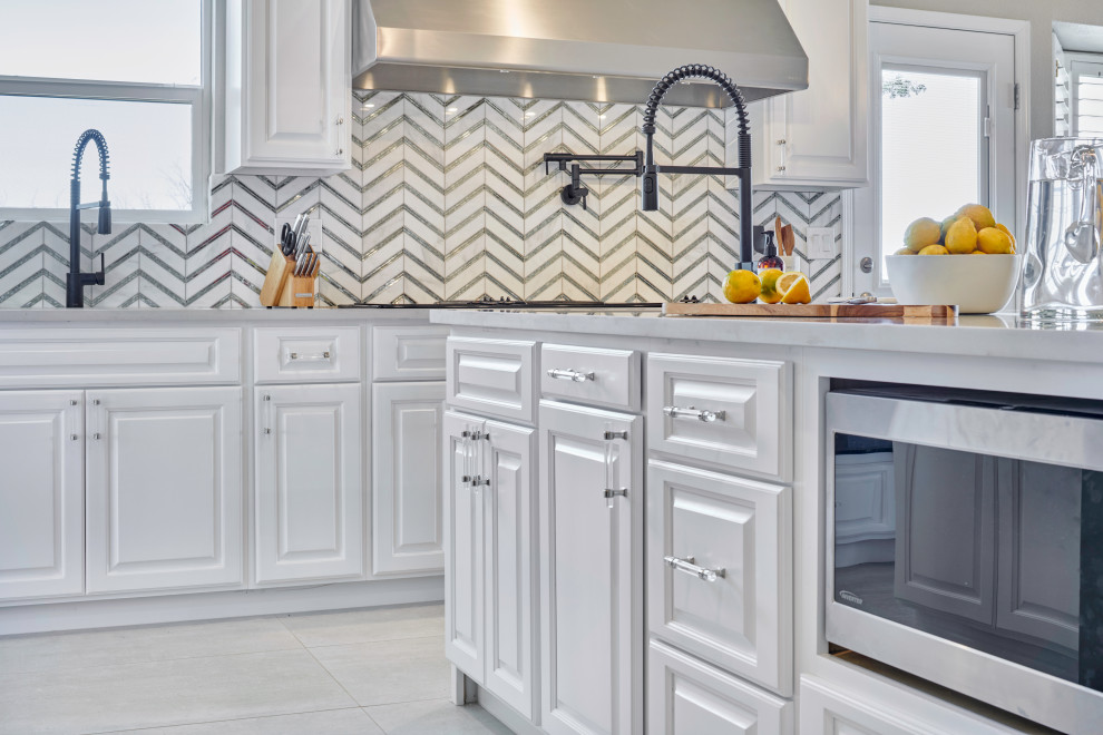 Example of a small transitional l-shaped porcelain tile and gray floor eat-in kitchen design with an undermount sink, beaded inset cabinets, white cabinets, quartzite countertops, multicolored backsplash, glass sheet backsplash, black appliances, a peninsula and white countertops