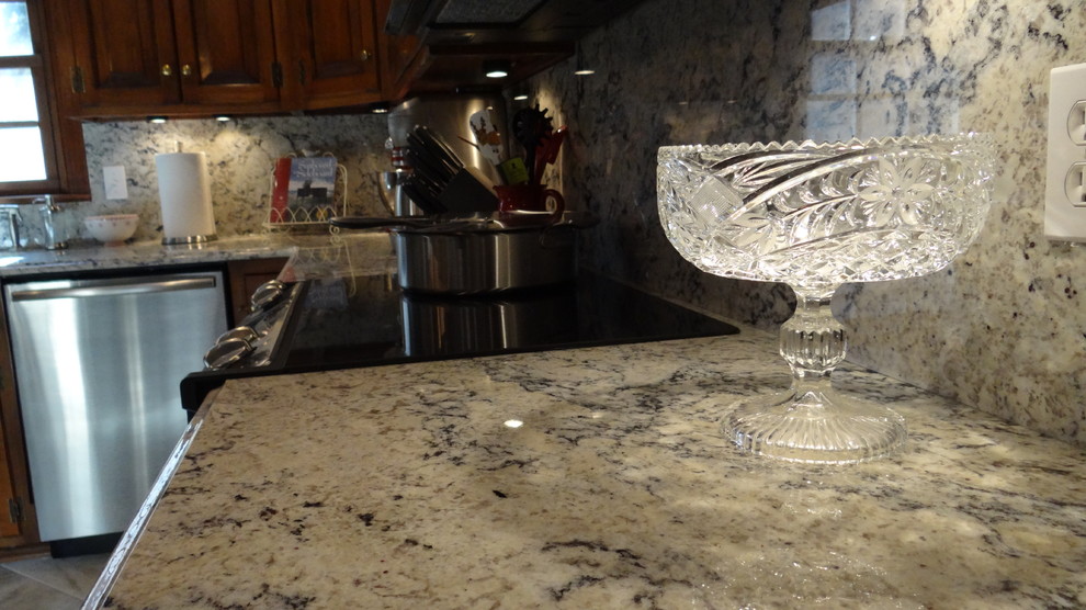 White eyes granite with full height granite backsplash Traditional
