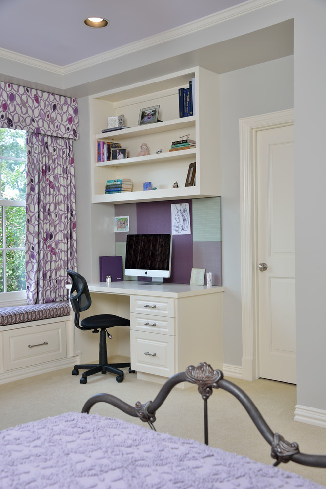 Inspiration for a small transitional built-in desk carpeted kids' room remodel in Houston with gray walls